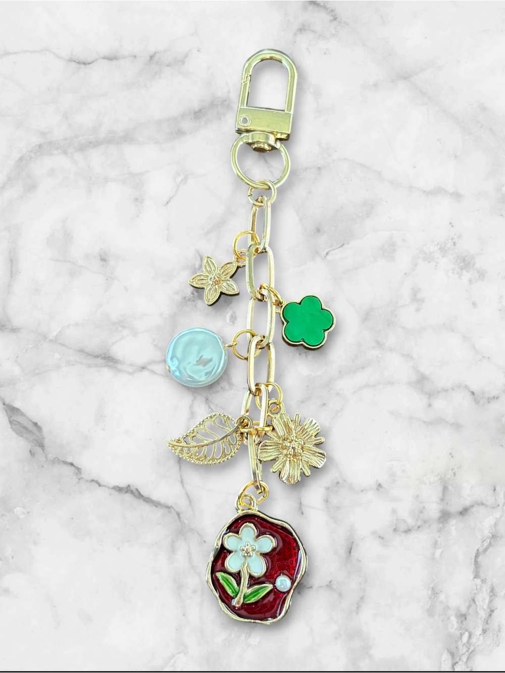 Gold Tone Floral Charm Keychain with Red Enamel Pendant